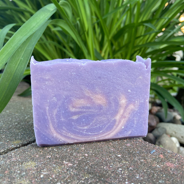 goat milk soap bar with swirls of purple