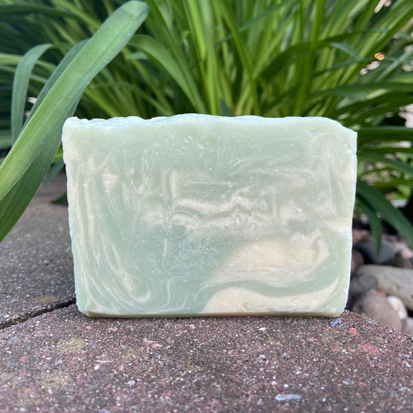 green and white swirls on a goat milk soap bar scented with eucalyptus and spearmint