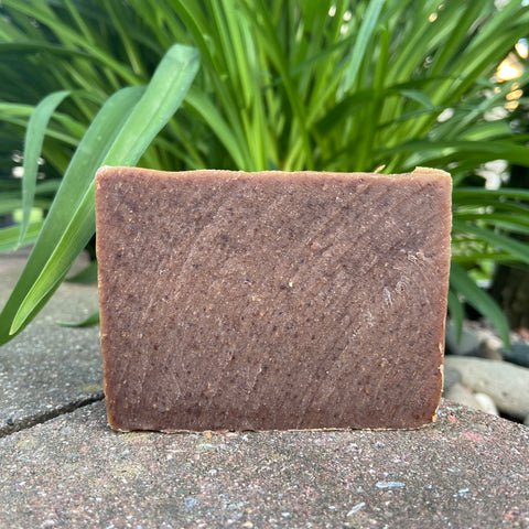 frankincense myrrh soap bar is brown with spots